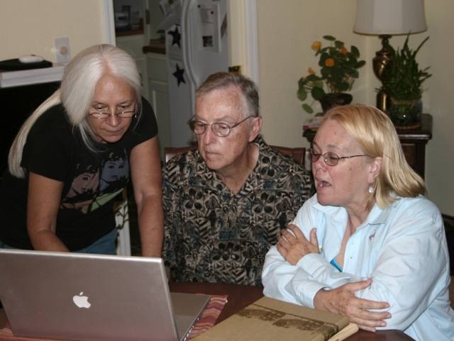 Mr. Sharretts, Lu Soria and Lori Haile Sunderland looking at the DV68 website